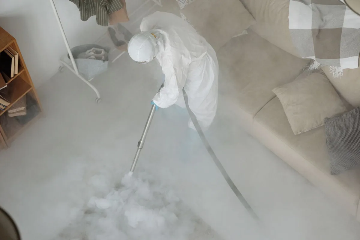 Biohazard cleanup technician in protective equipment, Oakhurst, CA